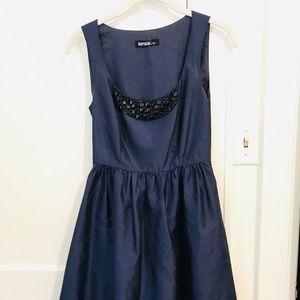 Silk navy dress with beaded detailing at neckline